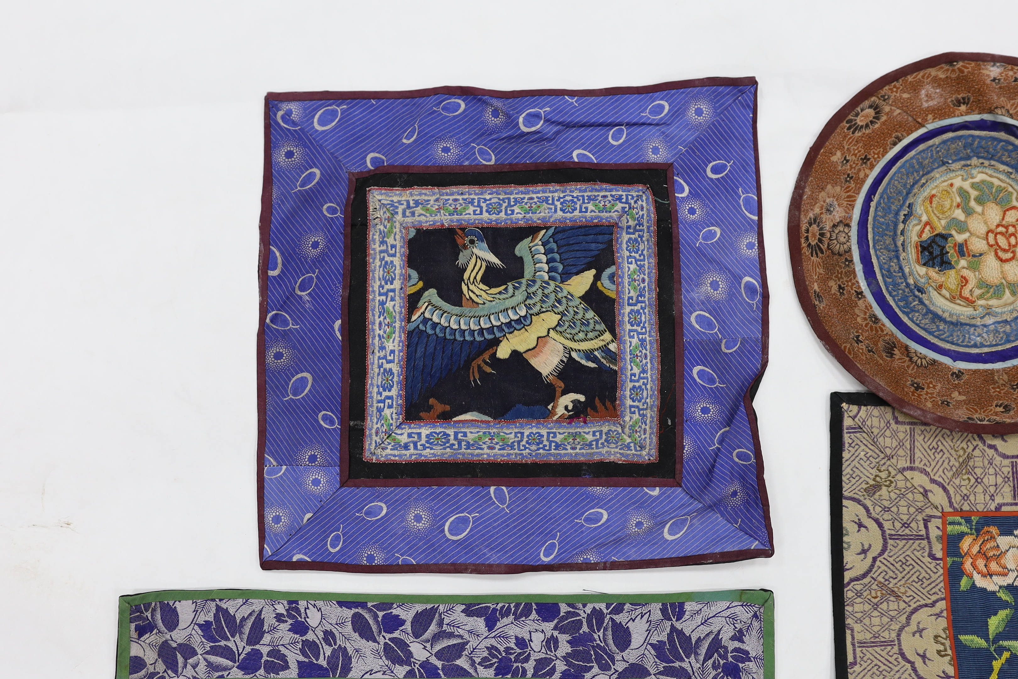A Kesi Chinese woven panel, a Beijing knot mat, two other embroidered panels, a circular mat together with two sets of six circular mats with gold thread embroidery of animals